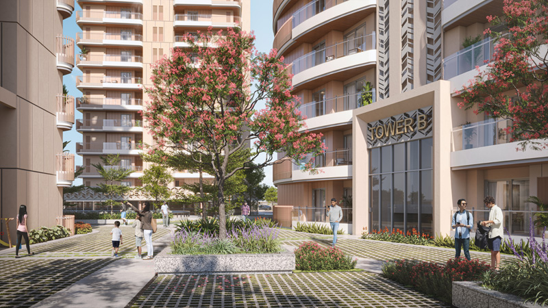 Tower B entrance with landscaped courtyard at Latitude 27